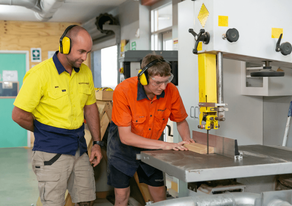 ATCNB student with trainer using drop saw